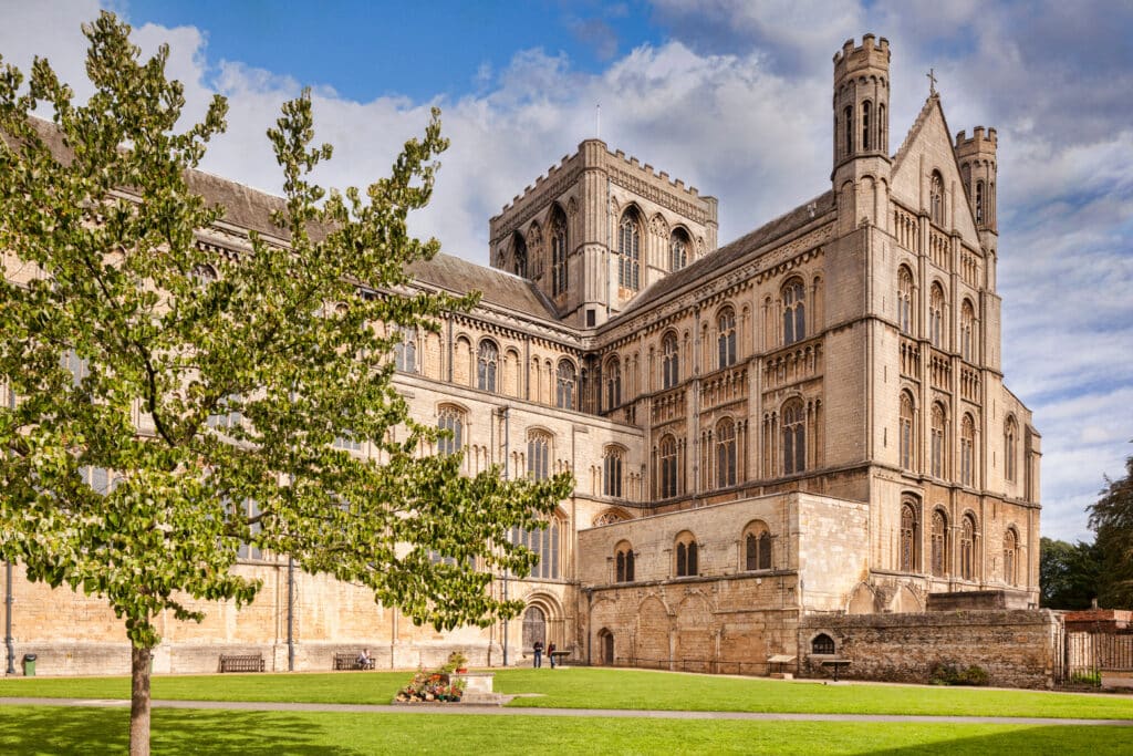 Historic cathedral with lush greenery.